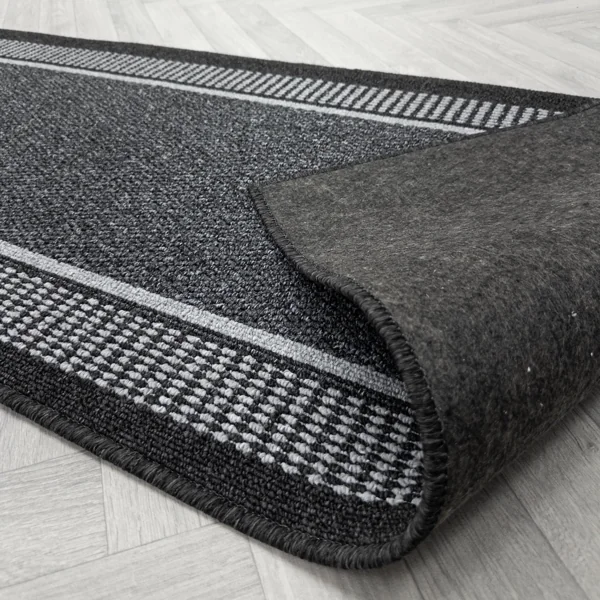 Black runner rug showing non-slip textured backing