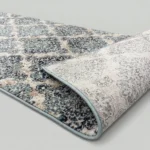 Black trellis rug showing non-slip textured backing