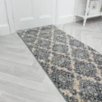 Black trellis runner rug on a white floor