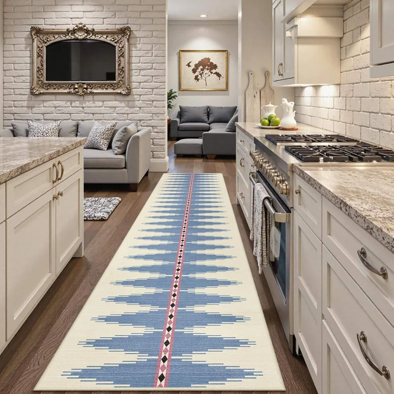 Blue geometric runner rug in a modern white kitchen.