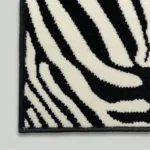 Close-up of black and white zebra pattern rug