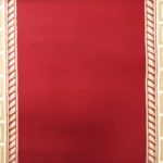 Greek key border on red background