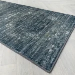 Grey chevron rug showing non-slip textured backing