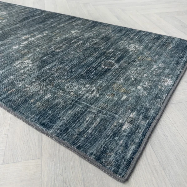 Grey chevron rug showing non-slip textured backing