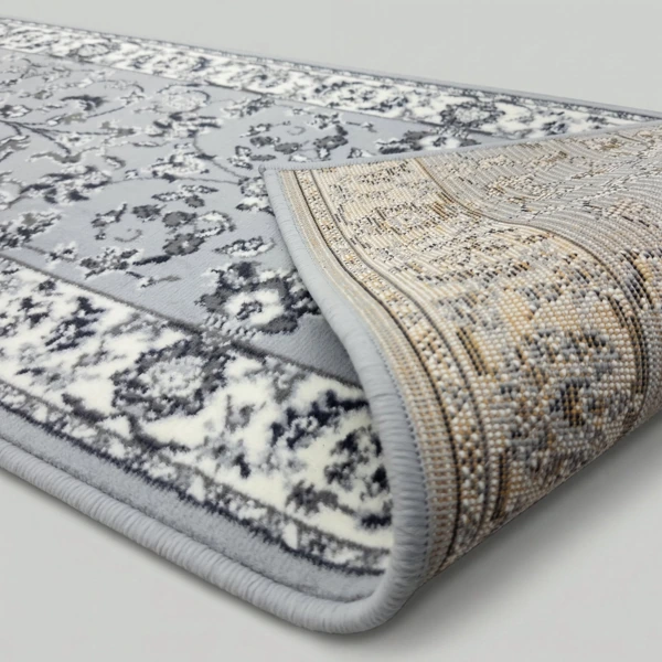 Grey geometric rug showing non-slip textured backing