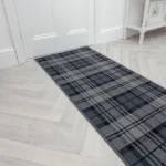 Grey tartan hallway runner rug by a white door