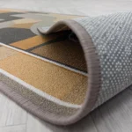 Grey trellis rug showing non-slip textured backing