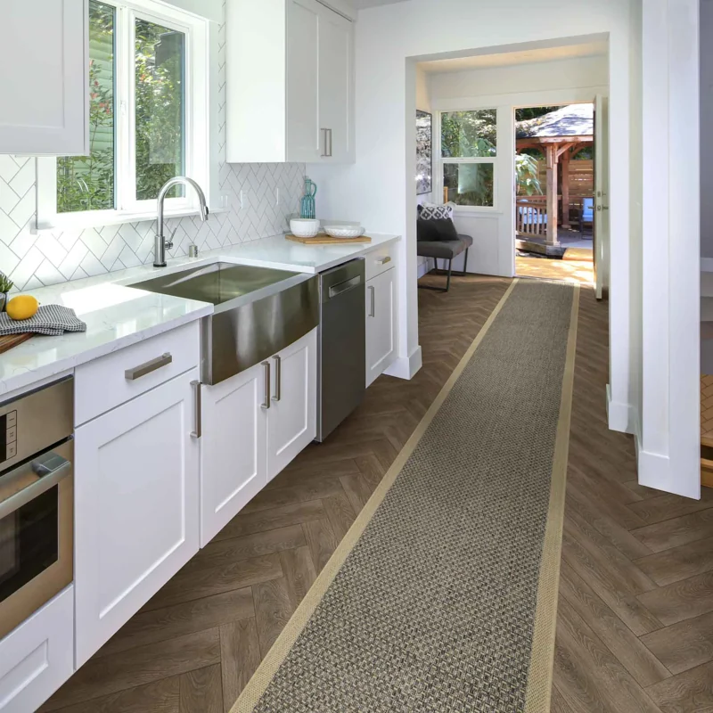 Natural woven kitchen runner rug on herringbone floor