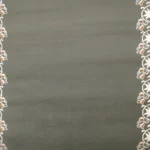 White floral scroll on dark gray background
