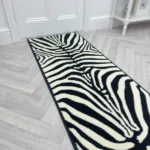 Zebra print runner rug on grey herringbone floor