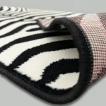 Zebra rug showing non-slip backing and edge